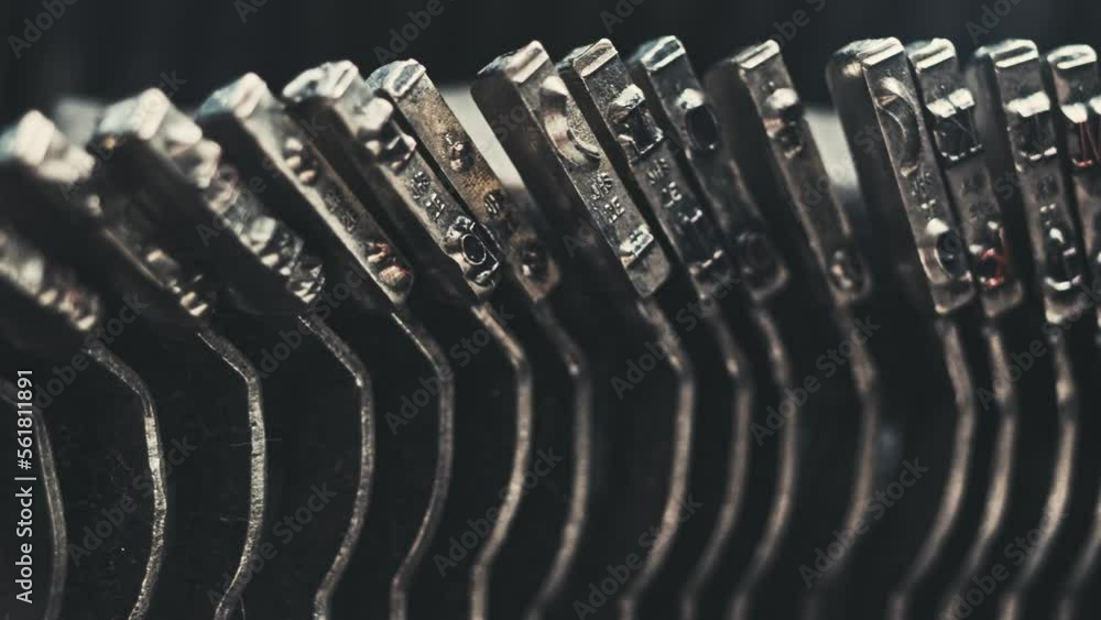 Poster letters and numbers on typo keys of an old manual typewriter on a retro writing machine, close up vi