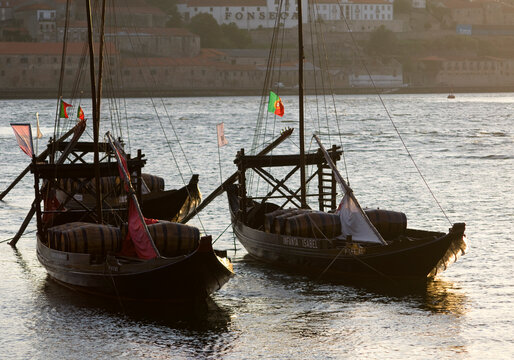 Porto, Two Port Wine Barges moored At sunset.