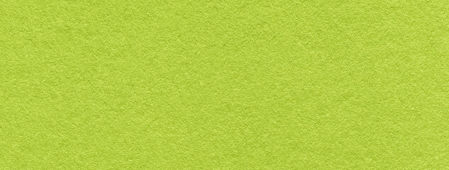 Plakat Texture of old bright green color paper background, macro. Structure of a vintage craft olive cardboard.