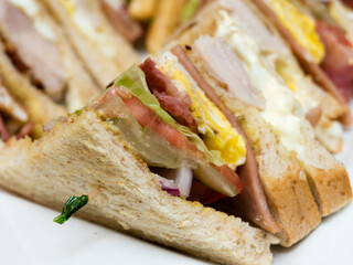 Club sandwich on white plate
