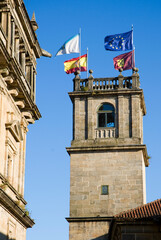 Flags flying on a church tower.  Santiago de Compostela.