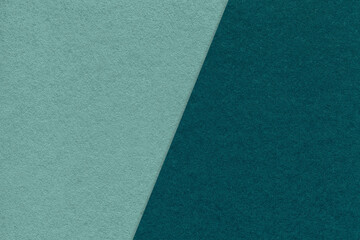 Texture of craft cyan and emerald paper background, half two colors, macro. Structure of vintage...