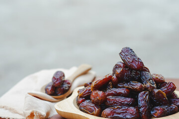 The dates in the wooden cups on the table were sweet, but lowered blood sugar. It is a fruit that Muslims like to eat during the month of Ramadan.