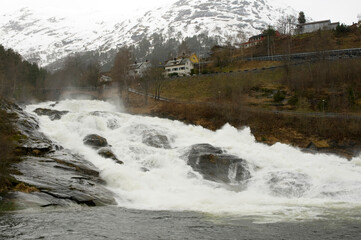 meltwater cascading through the waterfall at Hellesylt on the Geiranger fjord, Norway