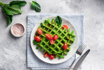 Spinach gluten free waffles on white plate. Healthy vegan food concept. table settings. top view