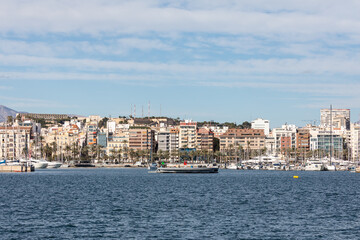 Alicante, Spain - January 15, 2023: seaside view of Alicante harbor skyline