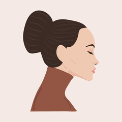Woman  in profile in a brown sweater