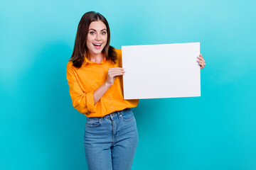Obraz na płótnie Canvas Photo of nice cute cheerful woman with straight hairdo dressed yellow shirt hold placard presentation isolated on teal color background