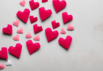 Fototapeta premium Illustration of red and pink origami hearts scattered on white background Generative AI