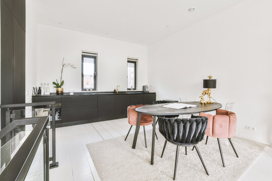 Spacious Open Plan Kitchen With White Walls And Beautiful Living Room