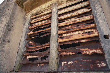 Old corroded rusted window shutters