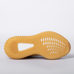 Yellow sole of shoes. Bottom of sneakers on a white background is insulated. with clipping path