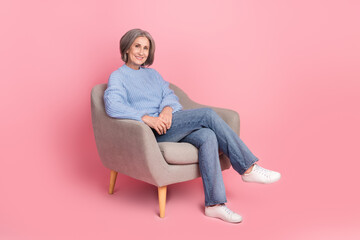 Fototapeta na wymiar Full length size cadre photo of confident positive successful woman sitting folded legs chill comfort armchair isolated on pink color background