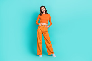 Fototapeta na wymiar Full length photo of gorgeous pretty cheerful lady interested look empty space cool proposition isolated on cyan color background