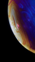 Soap bubble surface colorful macro photography. bubble surface resembles a planet. Selective focus close up photography. Wallpaper concept