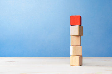 Leadership, dissenting opinion, divergent views concepts, Red wooden block standing out from the...