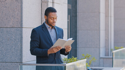African American man ethnic businessman employer entrepreneur office worker standing on balcony...