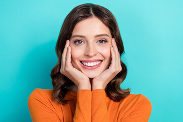 Close up photo of cute nice gentle lady wear trendy clothes arm hold under chin enjoy quality maquillage isolated on cyan color background