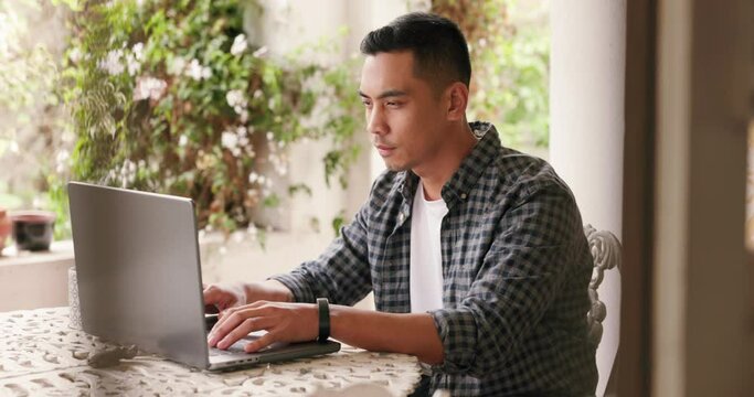 Asian man, laptop and SEO freelancer for web design, UX programming or online digital marketing startup. Coding, software and developer code website data, tech and cybersecurity IOT analytics report