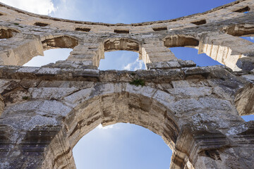 Under the arches of the amphitheater in Pula seen from the backstage in the amphitheater
