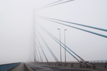 Solidarity Bridge over the Vistula River in Plock in the fog.