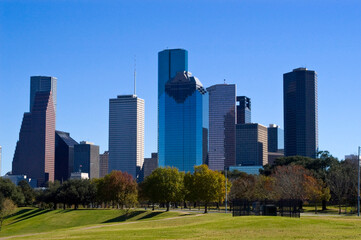 Fototapeta na wymiar Modern buildings in the Skyline district of downtown Houston, Texas taken across a park with trees