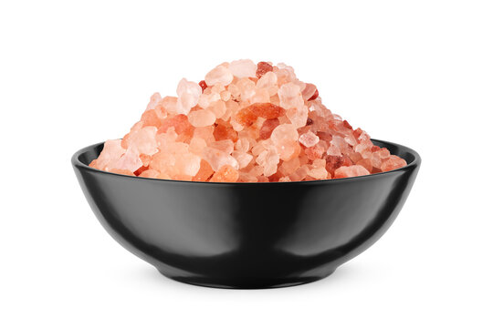 Himalayan coarse salt in black bowl isolated on white. Front view.