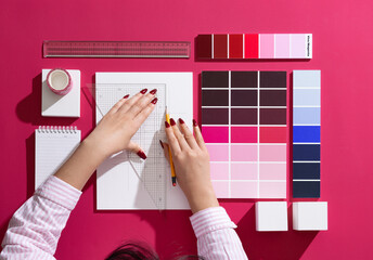A professional designer who designs with backgrounds and props in Viva Magenta color