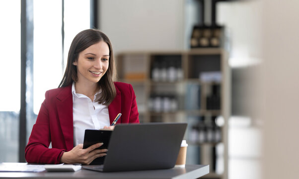 Business Woman Using Calculator For Do Math Finance On Wooden Desk In Office And Business Working Background, Tax, Accounting, Statistics And Analytic Research Concept