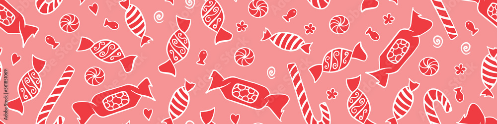 Wall mural Seamless pattern with red candies on pink background. Hand drawn sweets in wrappers. Vector illustration.