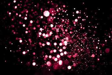 Viva magenta blurred abstract bokeh lights background. Snowy shiny glitter sparkle stars for holiday celebrate
