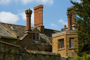 Chimneys, roofs and windows in the cotswolds at Adderbury