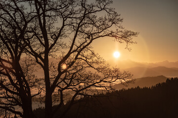 autumn sunset seen from Lorenziberg looking southwest over the foggy valleys of carinthia.