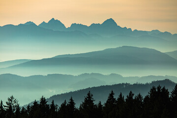 Sunset seen from Lorenziberg over the carithian valleys towards the Julian alps at the austrian and Slovenian border.