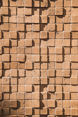 Beige square tile and its shadow. Texture background