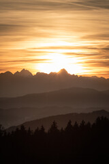 Sunset seen from Lorenziberg over the carithian valleys towards the karawanken mountain range and the Julian alps at the austrian and Slovenian border.