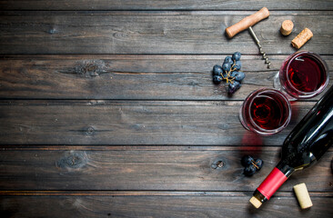 Wine background. Red wine with black grapes.
