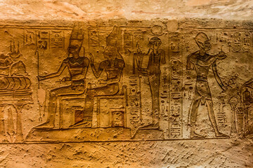 ABU SIMBEL, EGYPT - FEB 22, 2019: Wall carvings in the Great Temple of Ramesses II  in Abu Simbel, Egypt.