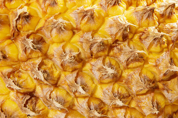 Fresh pineapple skin, close-up, natural seamless texture, bright, natural, exotic and warm colours