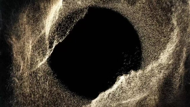Tiny particles flow and swirl in mesmerizing vortex with empty copy space in center. Perfect for adding message or logo. 4K seamless loop  on black background