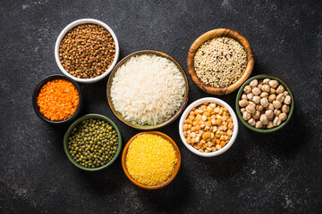 Gluten free food, cereals. Rice, buckwheat, corn, lentils, soy beans and quinoa at black. Allergen free. Top view image.