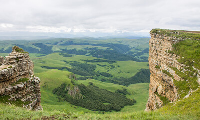 Dramatic landscape - panoramic view of the hilly valley from the Bermamyt plateau in...