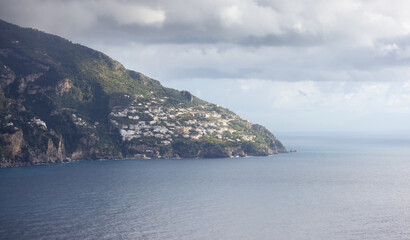 Fototapeta premium Touristic Town, Vettica Maggiore, on Rocky Cliffs and Mountain Landscape by the Tyrrhenian Sea. Amalfi Coast, Italy.