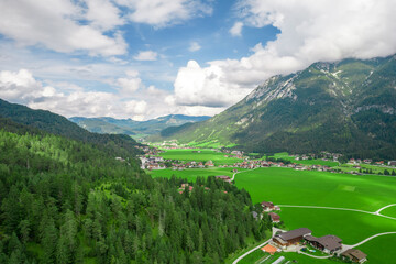 Austrian glacier water sea mountains lake landscape nature drone shot clouds sky green village alaska norway fjord blue forest 