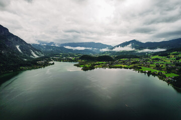 Austrian glacier water sea mountains lake landscape nature drone shot clouds sky green village alaska norway fjord blue forest 