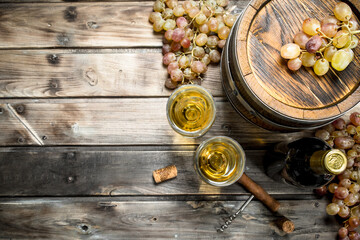 Wine background. White wine in an old barrel.