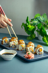 Sushi on a plate and chopsticks