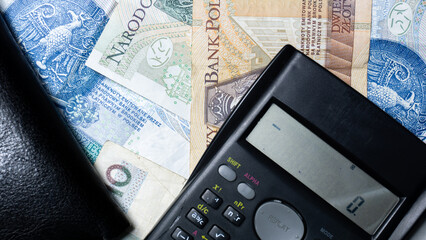 Cash money banknotes background. Photo for banner on website. Photo of accountancy or banking background. 100 zlotys, 200 zlotys, 50 zlotys. Changes in wages and taxes. Rising inflation. PLN