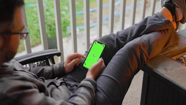 Person Scrolling On Iphone Green Screen