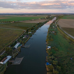Aerial view of fishing huts on river at sunset,italian fishing machine, called 